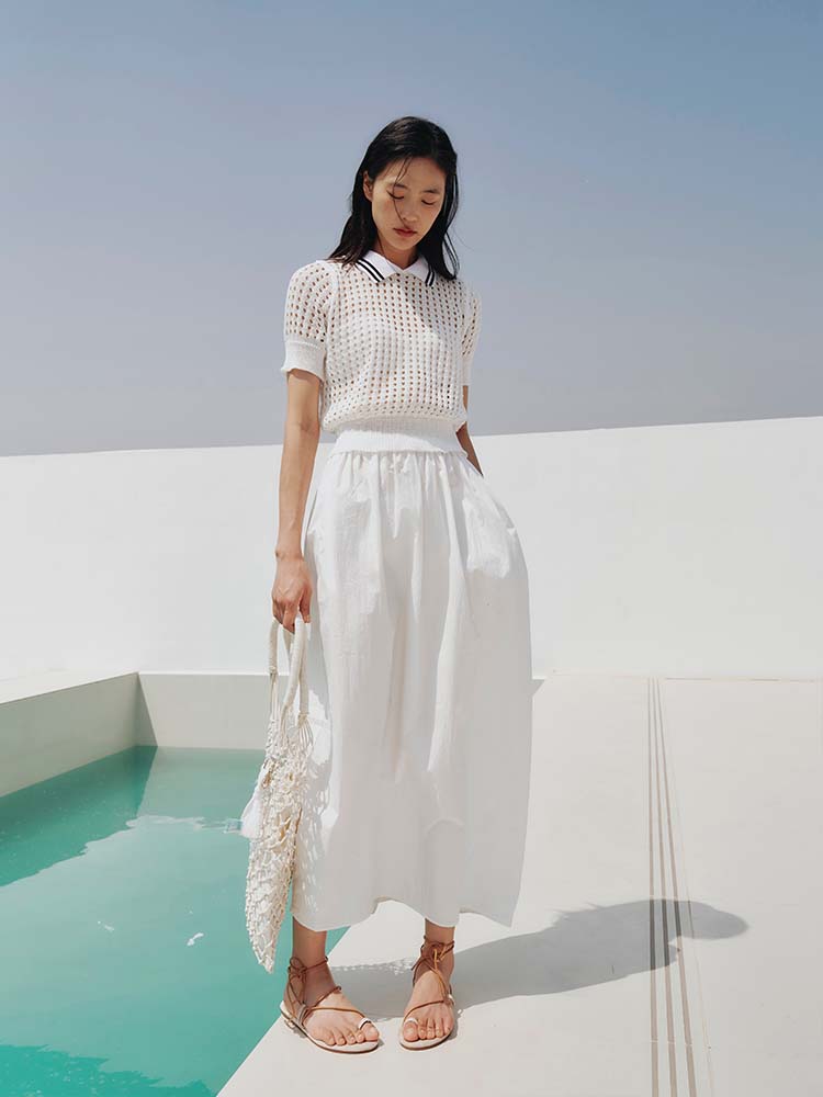 Hollow-out polo knit top